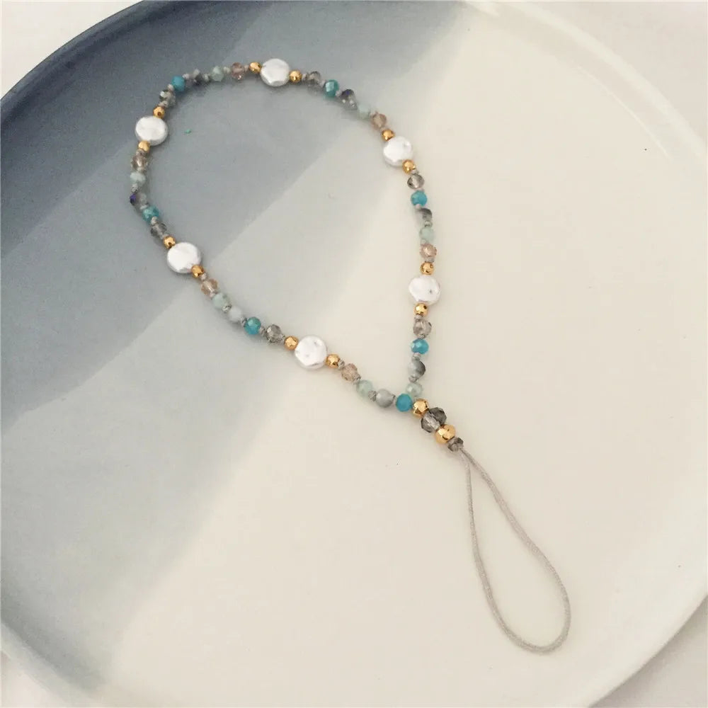 Beaded lanyard with a gray handle on a light background